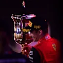 BAHRAIN, BAHRAIN - MARCH 20: Race winner Charles Leclerc of Monaco and Ferrari celebrates on the podium during the F1 Grand Prix of Bahrain at Bahrain International Circuit on March 20, 2022 in Bahrain, Bahrain. (Photo by Mario Renzi - Formula 1/Formula 1 via Getty Images)