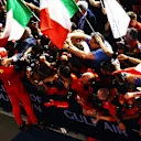 BAHRAIN, BAHRAIN - MARCH 20: Race winner Charles Leclerc of Monaco and Ferrari celebrates with his team in parc ferme during the F1 Grand Prix of Bahrain at Bahrain International Circuit on March 20, 2022 in Bahrain, Bahrain. (Photo by Mark Thompson/Getty Images)