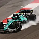 BAHRAIN, BAHRAIN - MARCH 11: Sebastian Vettel of Germany driving the (5) Aston Martin AMR22 Mercedes locks a wheel under braking during Day Two of F1 Testing at Bahrain International Circuit on March 11, 2022 in Bahrain, Bahrain. (Photo by Lars Baron/Getty Images)