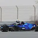 BAHRAIN, BAHRAIN - MARCH 11: Nicholas Latifi of Canada and Williams climbs from his car as his rear brakes catch fire during Day Two of F1 Testing at Bahrain International Circuit on March 11, 2022 in Bahrain, Bahrain. (Photo by Mark Thompson/Getty Images)