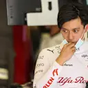 BAHRAIN, BAHRAIN - MARCH 10: Zhou Guanyu of China and Alfa Romeo F1 looks on in the garage during Day One of F1 Testing at Bahrain International Circuit on March 10, 2022 in Bahrain, Bahrain. (Photo by Mark Thompson/Getty Images)