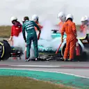BARCELONA, SPAIN - FEBRUARY 25: Sebastian Vettel of Germany and Aston Martin F1 Team uses a fire extinguisher on his car after he stopped on track during Day Three of F1 Testing at Circuit de Barcelona-Catalunya on February 25, 2022 in Barcelona, Spain. (Photo by Dan Istitene - Formula 1/Formula 1 via Getty Images)