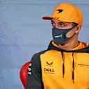 BARCELONA, SPAIN - FEBRUARY 25: Lando Norris of Great Britain and McLaren looks on in the Drivers Press Conference during Day Three of F1 Testing at Circuit de Barcelona-Catalunya on February 25, 2022 in Barcelona, Spain. (Photo by James Bearne - Pool/Getty Images)