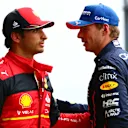 SPA, BELGIUM - AUGUST 27: Pole position qualifier Max Verstappen of the Netherlands and Oracle Red Bull Racing and Second placed qualifier Carlos Sainz of Spain and Ferrari talk in parc ferme during qualifying ahead of the F1 Grand Prix of Belgium at Circuit de Spa-Francorchamps on August 27, 2022 in Spa, Belgium. (Photo by Dan Istitene - Formula 1/Formula 1 via Getty Images)