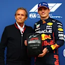 SPA, BELGIUM - AUGUST 27: Pole position qualifier Max Verstappen of the Netherlands and Oracle Red Bull Racing is presented with the Pirelli Pole Position trophy by Jacky Ickx in parc ferme during qualifying ahead of the F1 Grand Prix of Belgium at Circuit de Spa-Francorchamps on August 27, 2022 in Spa, Belgium. (Photo by Dan Istitene - Formula 1/Formula 1 via Getty Images)