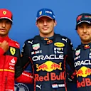 SPA, BELGIUM - AUGUST 27: Pole position qualifier Max Verstappen of the Netherlands and Oracle Red Bull Racing (C), Second placed qualifier Carlos Sainz of Spain and Ferrari (L) and Third placed qualifier Sergio Perez of Mexico and Oracle Red Bull Racing (R) pose for a photo in parc ferme during qualifying ahead of the F1 Grand Prix of Belgium at Circuit de Spa-Francorchamps on August 27, 2022 in Spa, Belgium. (Photo by Dan Istitene - Formula 1/Formula 1 via Getty Images)