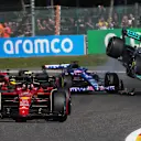SPA, BELGIUM - AUGUST 28: Carlos Sainz of Spain driving (55) the Ferrari F1-75 leads the field as Fernando Alonso of Spain driving the (14) Alpine F1 A522 Renault and Lewis Hamilton of Great Britain driving the (44) Mercedes AMG Petronas F1 Team W13 crash during the F1 Grand Prix of Belgium at Circuit de Spa-Francorchamps on August 28, 2022 in Spa, Belgium. (Photo by Joe Portlock - Formula 1/Formula 1 via Getty Images)