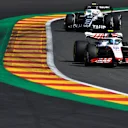 SPA, BELGIUM - AUGUST 28: Mick Schumacher of Germany driving the (47) Haas F1 VF-22 Ferrari leads Yuki Tsunoda of Japan driving the (22) Scuderia AlphaTauri AT03 during the F1 Grand Prix of Belgium at Circuit de Spa-Francorchamps on August 28, 2022 in Spa, Belgium. (Photo by Rudy Carezzevoli/Getty Images)