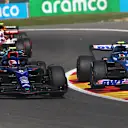 SPA, BELGIUM - AUGUST 28: Esteban Ocon of France driving the (31) Alpine F1 A522 Renault and Nicholas Latifi of Canada driving the (6) Williams FW44 Mercedes battle for track position during the F1 Grand Prix of Belgium at Circuit de Spa-Francorchamps on August 28, 2022 in Spa, Belgium. (Photo by Joe Portlock - Formula 1/Formula 1 via Getty Images)