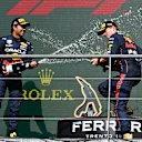 SPA, BELGIUM - AUGUST 28: Race winner Max Verstappen of the Netherlands and Oracle Red Bull Racing and Second placed Sergio Perez of Mexico and Oracle Red Bull Racing celebrate on the podium during the F1 Grand Prix of Belgium at Circuit de Spa-Francorchamps on August 28, 2022 in Spa, Belgium. (Photo by Dan Mullan/Getty Images)