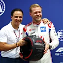 SAO PAULO, BRAZIL - NOVEMBER 11: Pole position qualifier Kevin Magnussen of Denmark and Haas F1 is presented with the Pirelli Pole Position trophy by Felipe Massa during qualifying ahead of the F1 Grand Prix of Brazil at Autodromo Jose Carlos Pace on November 11, 2022 in Sao Paulo, Brazil. (Photo by Dan Istitene - Formula 1/Formula 1 via Getty Images)