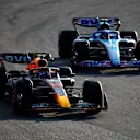 SAO PAULO, BRAZIL - NOVEMBER 12: Sergio Perez of Mexico driving the (11) Oracle Red Bull Racing RB18 leads Esteban Ocon of France driving the (31) Alpine F1 A522 Renault during the Sprint ahead of the F1 Grand Prix of Brazil at Autodromo Jose Carlos Pace on November 12, 2022 in Sao Paulo, Brazil. (Photo by Jared C. Tilton/Getty Images)