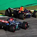 SAO PAULO, BRAZIL - NOVEMBER 12: Max Verstappen of the Netherlands driving the (1) Oracle Red Bull Racing RB18 leads George Russell of Great Britain driving the (63) Mercedes AMG Petronas F1 Team W13 during the Sprint ahead of the F1 Grand Prix of Brazil at Autodromo Jose Carlos Pace on November 12, 2022 in Sao Paulo, Brazil. (Photo by Mark Thompson/Getty Images)