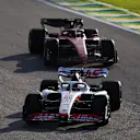 SAO PAULO, BRAZIL - NOVEMBER 12: Kevin Magnussen of Denmark driving the (20) Haas F1 VF-22 Ferrari leads Carlos Sainz of Spain driving (55) the Ferrari F1-75 during the Sprint ahead of the F1 Grand Prix of Brazil at Autodromo Jose Carlos Pace on November 12, 2022 in Sao Paulo, Brazil. (Photo by Bryn Lennon - Formula 1/Formula 1 via Getty Images)