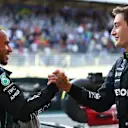 SAO PAULO, BRAZIL - NOVEMBER 12: Sprint winner George Russell of Great Britain and Mercedes and Third placed Lewis Hamilton of Great Britain and Mercedes celebrate in parc ferme during the Sprint ahead of the F1 Grand Prix of Brazil at Autodromo Jose Carlos Pace on November 12, 2022 in Sao Paulo, Brazil. (Photo by Dan Istitene - Formula 1/Formula 1 via Getty Images)