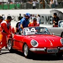 SAO PAULO, BRAZIL - NOVEMBER 13: Track marshals help Fernando Alonso of Spain and Alpine F1 as his car stops on the drivers parade prior to the F1 Grand Prix of Brazil at Autodromo Jose Carlos Pace on November 13, 2022 in Sao Paulo, Brazil. (Photo by Chris Graythen/Getty Images)