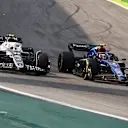 SAO PAULO, BRAZIL - NOVEMBER 13: Yuki Tsunoda of Japan driving the (22) Scuderia AlphaTauri AT03 and Nicholas Latifi of Canada driving the (6) Williams FW44 Mercedes battle for track position during the F1 Grand Prix of Brazil at Autodromo Jose Carlos Pace on November 13, 2022 in Sao Paulo, Brazil. (Photo by Chris Graythen/Getty Images)