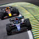 SAO PAULO, BRAZIL - NOVEMBER 13: Alexander Albon of Thailand driving the (23) Williams FW44 Mercedes leads Max Verstappen of the Netherlands driving the (1) Oracle Red Bull Racing RB18 during the F1 Grand Prix of Brazil at Autodromo Jose Carlos Pace on November 13, 2022 in Sao Paulo, Brazil. (Photo by Jared C. Tilton/Getty Images)