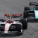 SAO PAULO, BRAZIL - NOVEMBER 13: Zhou Guanyu of China driving the (24) Alfa Romeo F1 C42 Ferrari leads Lance Stroll of Canada driving the (18) Aston Martin AMR22 Mercedes during the F1 Grand Prix of Brazil at Autodromo Jose Carlos Pace on November 13, 2022 in Sao Paulo, Brazil. (Photo by Bryn Lennon - Formula 1/Formula 1 via Getty Images)