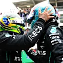SAO PAULO, BRAZIL - NOVEMBER 13: Race winner George Russell of Great Britain and Mercedes and Second placed Lewis Hamilton of Great Britain and Mercedes celebrates in parc ferme during the F1 Grand Prix of Brazil at Autodromo Jose Carlos Pace on November 13, 2022 in Sao Paulo, Brazil. (Photo by Dan Istitene - Formula 1/Formula 1 via Getty Images)