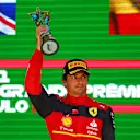 SAO PAULO, BRAZIL - NOVEMBER 13: Third placed Carlos Sainz of Spain and Ferrari celebrates on the podium during the F1 Grand Prix of Brazil at Autodromo Jose Carlos Pace on November 13, 2022 in Sao Paulo, Brazil. (Photo by Mark Thompson/Getty Images)