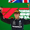 SAO PAULO, BRAZIL - NOVEMBER 13: Race winner George Russell of Great Britain and Mercedes celebrates on the podium during the F1 Grand Prix of Brazil at Autodromo Jose Carlos Pace on November 13, 2022 in Sao Paulo, Brazil. (Photo by Chris Graythen/Getty Images)