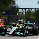 MONTREAL, QUEBEC - JUNE 19: Lewis Hamilton of Great Britain driving the (44) Mercedes AMG Petronas F1 Team W13 leads Kevin Magnussen of Denmark driving the (20) Haas F1 VF-22 Ferrari during the F1 Grand Prix of Canada at Circuit Gilles Villeneuve on June 19, 2022 in Montreal, Quebec. (Photo by Lars Baron - Formula 1/Formula 1 via Getty Images)