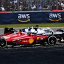 MONTREAL, QUEBEC - JUNE 19: Pierre Gasly of France driving the (10) Scuderia AlphaTauri AT03 leads Charles Leclerc of Monaco driving the (16) Ferrari F1-75 during the F1 Grand Prix of Canada at Circuit Gilles Villeneuve on June 19, 2022 in Montreal, Quebec. (Photo by Dan Mullan/Getty Images)