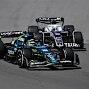MONTREAL, QUEBEC - JUNE 19: Lance Stroll of Canada driving the (18) Aston Martin AMR22 Mercedes leads Pierre Gasly of France driving the (10) Scuderia AlphaTauri AT03 during the F1 Grand Prix of Canada at Circuit Gilles Villeneuve on June 19, 2022 in Montreal, Quebec. (Photo by Dan Mullan/Getty Images)