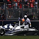 MONTREAL, QUEBEC - JUNE 19: Yuki Tsunoda of Japan and Scuderia AlphaTauri climbs from his car after crashing out of the race during the F1 Grand Prix of Canada at Circuit Gilles Villeneuve on June 19, 2022 in Montreal, Quebec. (Photo by Lars Baron - Formula 1/Formula 1 via Getty Images)