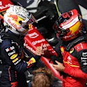 MONTREAL, QUEBEC - JUNE 19: Race winner Max Verstappen of the Netherlands and Oracle Red Bull Racing talks with Second placed Carlos Sainz of Spain and Ferrari in parc ferme during the F1 Grand Prix of Canada at Circuit Gilles Villeneuve on June 19, 2022 in Montreal, Quebec. (Photo by Clive Rose/Getty Images)