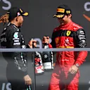 MONTREAL, QUEBEC - JUNE 19: Second placed Carlos Sainz of Spain and Ferrari and Third placed Lewis Hamilton of Great Britain and Mercedes celebrate on the podium during the F1 Grand Prix of Canada at Circuit Gilles Villeneuve on June 19, 2022 in Montreal, Quebec. (Photo by Dan Mullan/Getty Images)