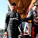 MONTREAL, QUEBEC - JUNE 19: Race winner Max Verstappen of the Netherlands and Oracle Red Bull Racing and Third placed Lewis Hamilton of Great Britain and Mercedes celebrate on the podium during the F1 Grand Prix of Canada at Circuit Gilles Villeneuve on June 19, 2022 in Montreal, Quebec. (Photo by Dan Istitene - Formula 1/Formula 1 via Getty Images)