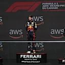 MONTREAL, QUEBEC - JUNE 19: Race winner Max Verstappen of the Netherlands and Oracle Red Bull Racing (C), Second placed Carlos Sainz of Spain and Ferrari (L) and Third placed Lewis Hamilton of Great Britain and Mercedes (R) celebrate on the podium during the F1 Grand Prix of Canada at Circuit Gilles Villeneuve on June 19, 2022 in Montreal, Quebec. (Photo by Lars Baron - Formula 1/Formula 1 via Getty Images)