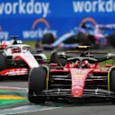 IMOLA, ITALY - APRIL 23: Carlos Sainz of Spain driving (55) the Ferrari F1-75 leads Kevin Magnussen of Denmark driving the (20) Haas F1 VF-22 Ferrari during Sprint ahead of the F1 Grand Prix of Emilia Romagna at Autodromo Enzo e Dino Ferrari on April 23, 2022 in Imola, Italy. (Photo by Dan Mullan/Getty Images)