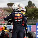 IMOLA, ITALY - APRIL 23: Sprint winner Max Verstappen of the Netherlands and Oracle Red Bull Racing and Third placed Sergio Perez of Mexico and Oracle Red Bull Racing hug in parc ferme during Sprint ahead of the F1 Grand Prix of Emilia Romagna at Autodromo Enzo e Dino Ferrari on April 23, 2022 in Imola, Italy. (Photo by Mark Thompson/Getty Images)
