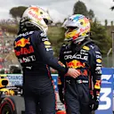 IMOLA, ITALY - APRIL 23: Sprint winner Max Verstappen of the Netherlands and Oracle Red Bull Racing and Third placed Sergio Perez of Mexico and Oracle Red Bull Racing talk in parc ferme during Sprint ahead of the F1 Grand Prix of Emilia Romagna at Autodromo Enzo e Dino Ferrari on April 23, 2022 in Imola, Italy. (Photo by Mark Thompson/Getty Images)