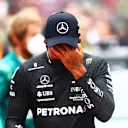 IMOLA, ITALY - APRIL 24: Lewis Hamilton of Great Britain and Mercedes wipes his face on the grid during the F1 Grand Prix of Emilia Romagna at Autodromo Enzo e Dino Ferrari on April 24, 2022 in Imola, Italy. (Photo by Dan Istitene - Formula 1/Formula 1 via Getty Images)