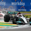 IMOLA, ITALY - APRIL 24: George Russell of Great Britain driving the (63) Mercedes AMG Petronas F1 Team W13 runs wide as he defends track position from Kevin Magnussen of Denmark driving the (20) Haas F1 VF-22 Ferrari during the F1 Grand Prix of Emilia Romagna at Autodromo Enzo e Dino Ferrari on April 24, 2022 in Imola, Italy. (Photo by Dan Mullan/Getty Images)