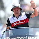 LE CASTELLET, FRANCE - JULY 24: Valtteri Bottas of Finland and Alfa Romeo F1 waves to the crowd on the drivers parade ahead of the F1 Grand Prix of France at Circuit Paul Ricard on July 24, 2022 in Le Castellet, France. (Photo by Bryn Lennon - Formula 1/Formula 1 via Getty Images)