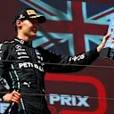 LE CASTELLET, FRANCE - JULY 24: Third placed George Russell of Great Britain and Mercedes celebrates on the podium during the F1 Grand Prix of France at Circuit Paul Ricard on July 24, 2022 in Le Castellet, France. (Photo by Bryn Lennon - Formula 1/Formula 1 via Getty Images)