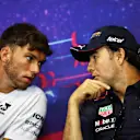 LE CASTELLET, FRANCE - JULY 21: Pierre Gasly of France and Scuderia AlphaTauri and Sergio Perez of Mexico and Oracle Red Bull Racing talk in the Drivers Press Conference during previews ahead of the F1 Grand Prix of France at Circuit Paul Ricard on July 21, 2022 in Le Castellet, France. (Photo by Bryn Lennon/Getty Images)