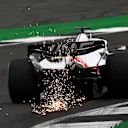 NORTHAMPTON, ENGLAND - JULY 02: Sparks fly behind Kevin Magnussen of Denmark driving the (20) Haas F1 VF-22 Ferrari on track during final practice ahead of the F1 Grand Prix of Great Britain at Silverstone on July 02, 2022 in Northampton, England. (Photo by Dan Mullan - Formula 1/Formula 1 via Getty Images)