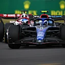 NORTHAMPTON, ENGLAND - JULY 03: Nicholas Latifi of Canada driving the (6) Williams FW44 Mercedes leads Valtteri Bottas of Finland driving the (77) Alfa Romeo F1 C42 Ferrari on track during the F1 Grand Prix of Great Britain at Silverstone on July 03, 2022 in Northampton, England. (Photo by Clive Mason/Getty Images)