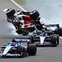 NORTHAMPTON, ENGLAND - JULY 03: Zhou Guanyu of China driving the (24) Alfa Romeo F1 C42 Ferrari crashes at the start during the F1 Grand Prix of Great Britain at Silverstone on July 03, 2022 in Northampton, England. (Photo by Mark Thompson/Getty Images)
