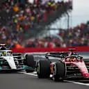 NORTHAMPTON, ENGLAND - JULY 03: Charles Leclerc of Monaco driving the (16) Ferrari F1-75 leads Lewis Hamilton of Great Britain driving the (44) Mercedes AMG Petronas F1 Team W13 during the F1 Grand Prix of Great Britain at Silverstone on July 03, 2022 in Northampton, England. (Photo by Joe Portlock - Formula 1/Formula 1 via Getty Images)