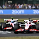 NORTHAMPTON, ENGLAND - JULY 03: Kevin Magnussen of Denmark driving the (20) Haas F1 VF-22 Ferrari leads Mick Schumacher of Germany driving the (47) Haas F1 VF-22 Ferrari on track during the F1 Grand Prix of Great Britain at Silverstone on July 03, 2022 in Northampton, England. (Photo by Clive Mason/Getty Images)