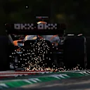 BUDAPEST, HUNGARY - JULY 29: Sparks fly behind Daniel Ricciardo of Australia driving the (3) McLaren MCL36 Mercedes during practice ahead of the F1 Grand Prix of Hungary at Hungaroring on July 29, 2022 in Budapest, Hungary. (Photo by Bryn Lennon - Formula 1/Formula 1 via Getty Images)