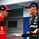 BUDAPEST, HUNGARY - JULY 30: Pole position qualifier George Russell of Great Britain and Mercedes talks with Third placed qualifier Charles Leclerc of Monaco and Ferrari in parc ferme during qualifying ahead of the F1 Grand Prix of Hungary at Hungaroring on July 30, 2022 in Budapest, Hungary. (Photo by Dan Istitene - Formula 1/Formula 1 via Getty Images)