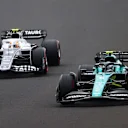 BUDAPEST, HUNGARY - JULY 31: Sebastian Vettel of Germany driving the (5) Aston Martin AMR22 Mercedes leads Yuki Tsunoda of Japan driving the (22) Scuderia AlphaTauri AT03 during the F1 Grand Prix of Hungary at Hungaroring on July 31, 2022 in Budapest, Hungary. (Photo by Dan Istitene - Formula 1/Formula 1 via Getty Images)